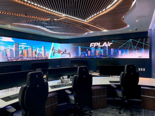 Drone operations room at FPL with a curved video wall and operator consoles