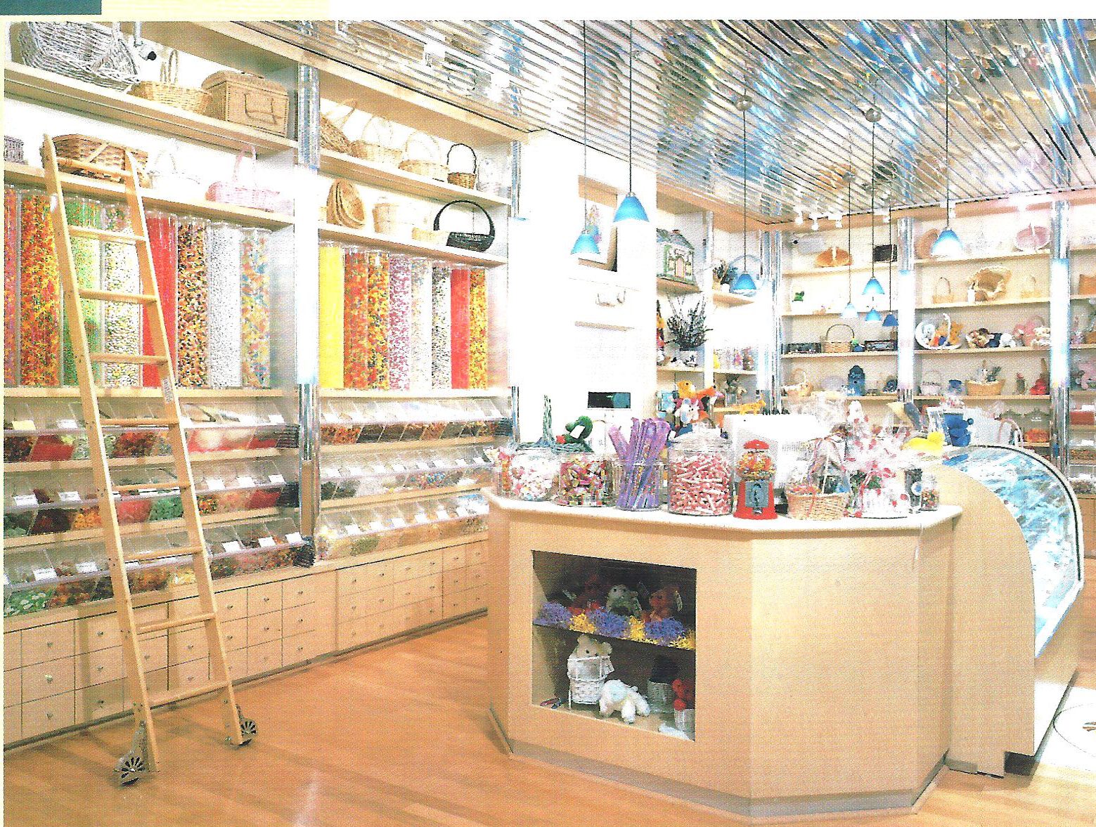 Candy store interior with a rolling ladder and rows of glass jars