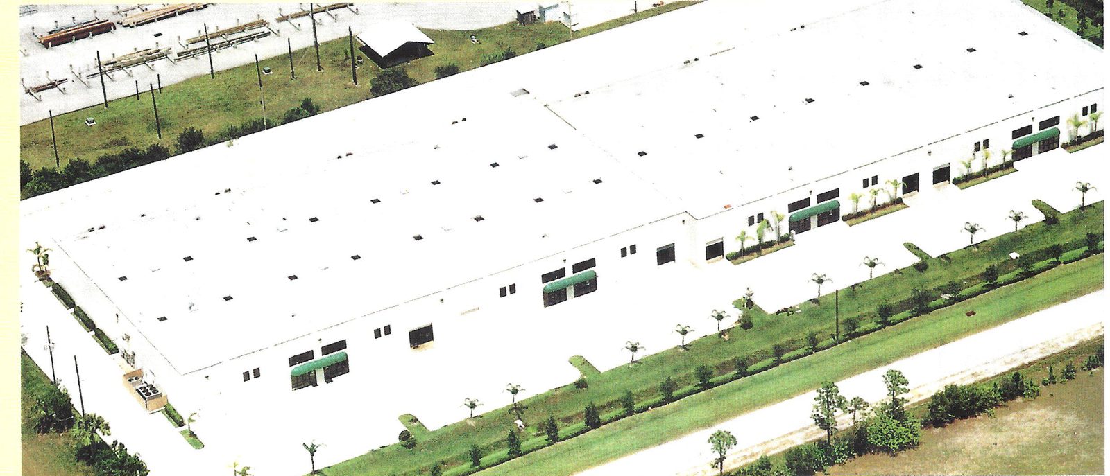Aerial view of the long tilt-up Sands Commerce Center building
